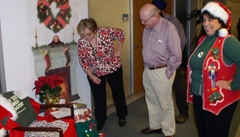 Lynn Tierney and President Yudof helped judge decorations. 