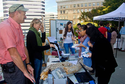Acorn woodpecker granaries and oak research drew lots of visitors to the Hastings Natural History Reservation table, where director Vince Voegeli (left) and his wife Sandy answered questions. Image credit: Lobsang Wangdu