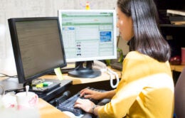 Woman sitting at computer