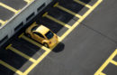 yellow car in parking lot