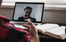 Man attending a virtual meeting on his laptop