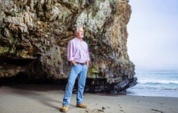 Man standing next to ocean