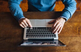 Person typing on a laptop computer