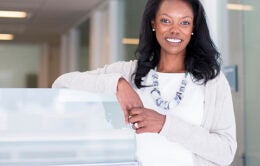 Smiling woman dressed in white