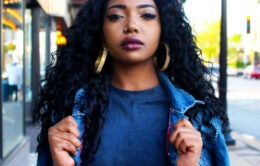 Woman walking wearing backpack