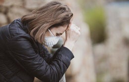 Stressed woman wearing mask