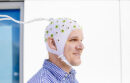 Man wearing MRI machine headpiece