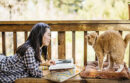 Woman reading with cat