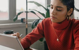 Woman working on digital notebook