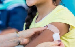 Woman receiving vaccine