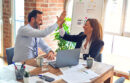 Colleagues giving each other a high-five