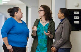 Women talking in hallway at UCOP