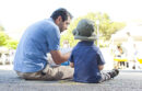 Man and child sitting together