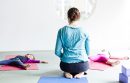 Woman doing yoga with children