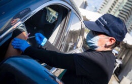 Dr. Carrie Byington administers a vaccine