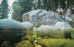 Man hiking over rocks