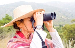 Woman holding binoculars