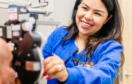 Nurse checking patient's eyesight