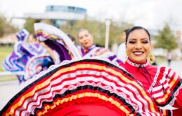 Women dancing in traditional Mexican dresses