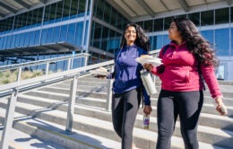 Two women walk at UC Merrced