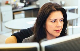 Woman working at desktop computer