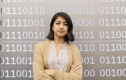 Woman standing in front of data set