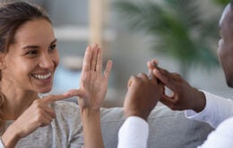 Two people talking in sign language