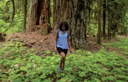 Woman walking through the woods