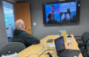 Lakeside Speakeasy Toastmasters members participate in a hybrid meeting with members in the Oakland office and on Zoom.