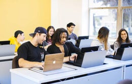 UC students working on computers in a classroom