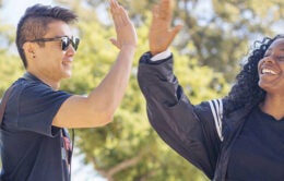 UC Davis students sharing a high-five