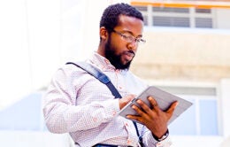Man reading something on an iPad