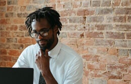 Man contemplating computer