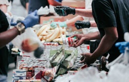 Volunteers sorting food at a food bank