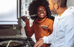 Couple cooking together in a kitchen