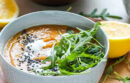 Bowl of soup with arugula