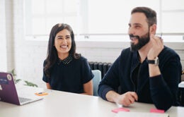 Woman and man participating in a meeting