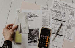 Person sorting through tax paperwork