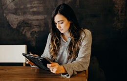 Woman working on a tablet computer
