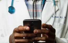 Doctor holding cellphone