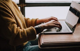 Person using laptop computer on desk