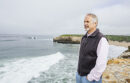 Man standing by the beach