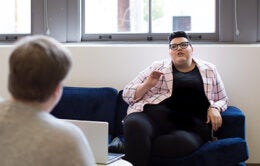 People having a conversation in an office