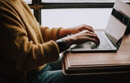 Person typing on laptop computer