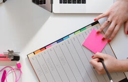 Person making notes in a planner