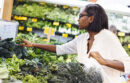 Woman buying kale