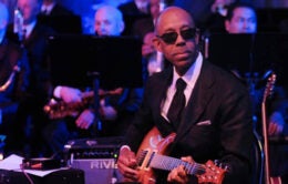 Michael V. Drake, then chancellor at UC Irvine, plays guitar with JT and California Dreamin’ at a 2011 gala for the UCI medical school.