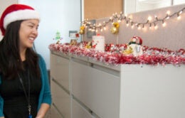 Woman looking at holiday decor at UCOP