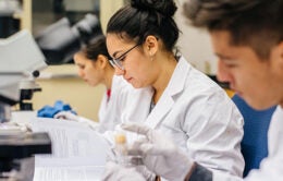 UC Heath researchers working with samples in a lab