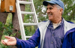 Smiling man holding an egg